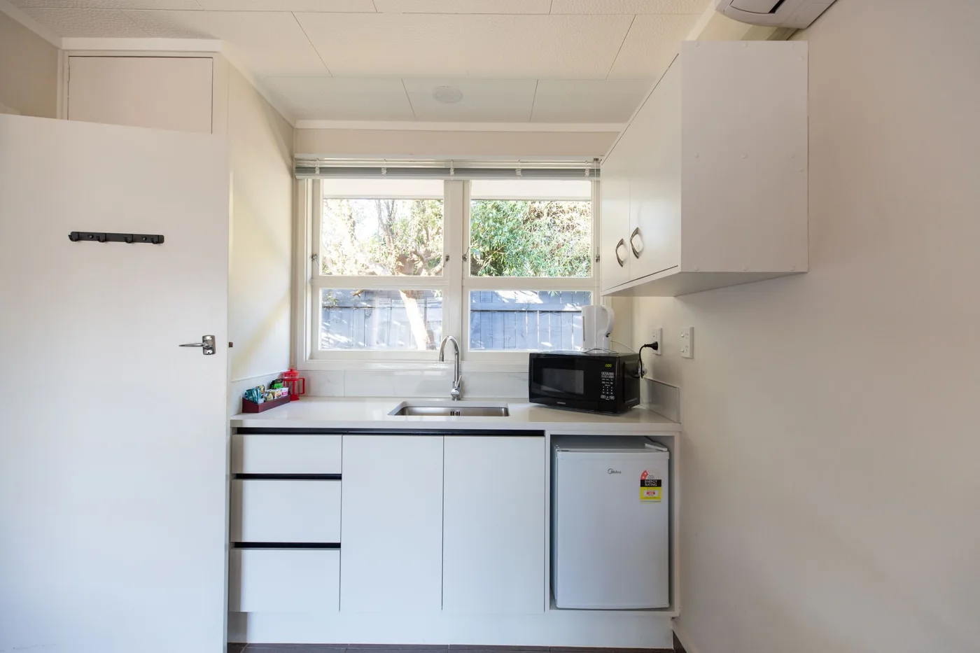 Kitchenette in the King Studio at Lake Breeze Motel