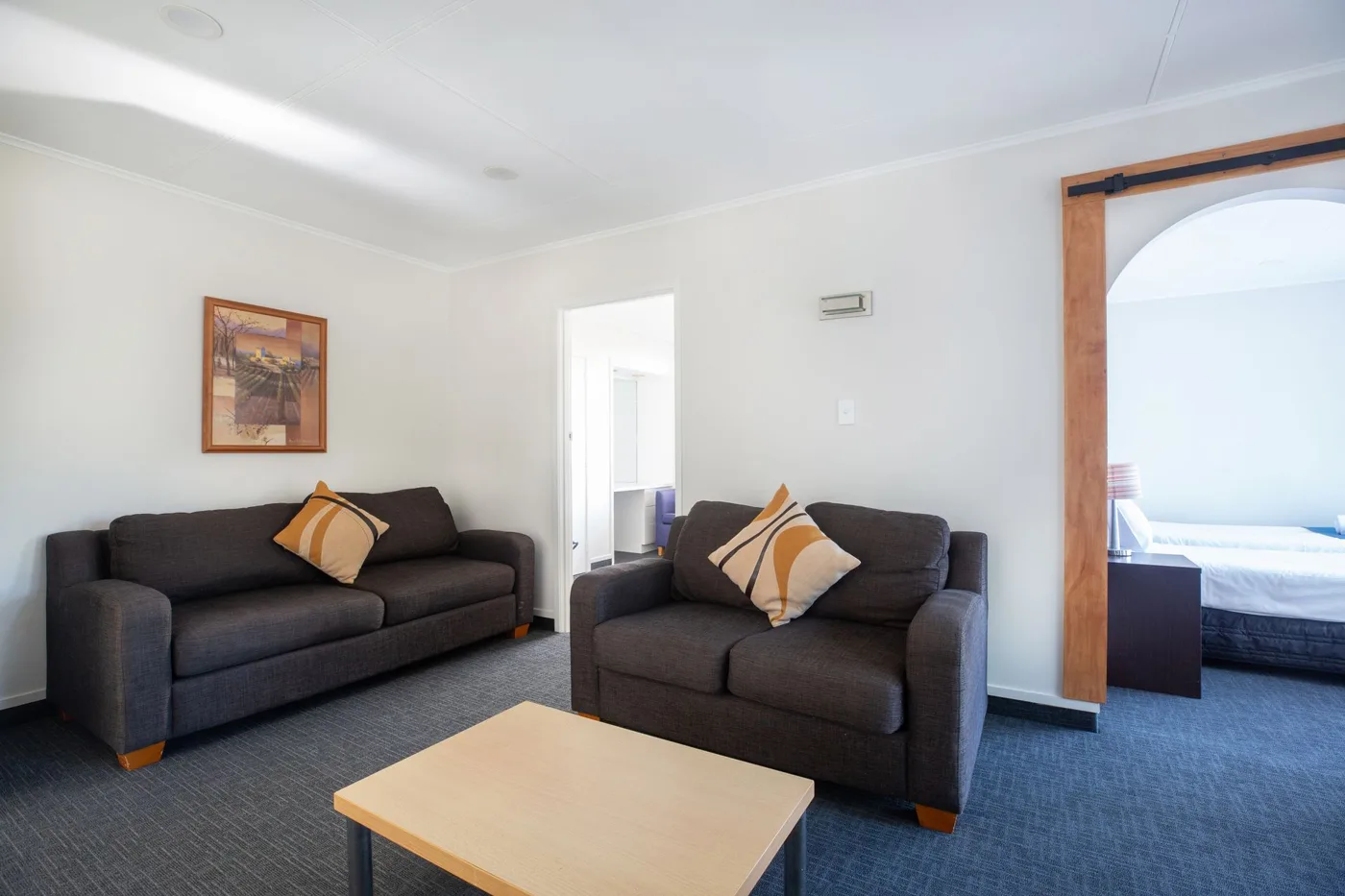 Living area in the Botanical Garden Apartment at Lake Breeze Motel